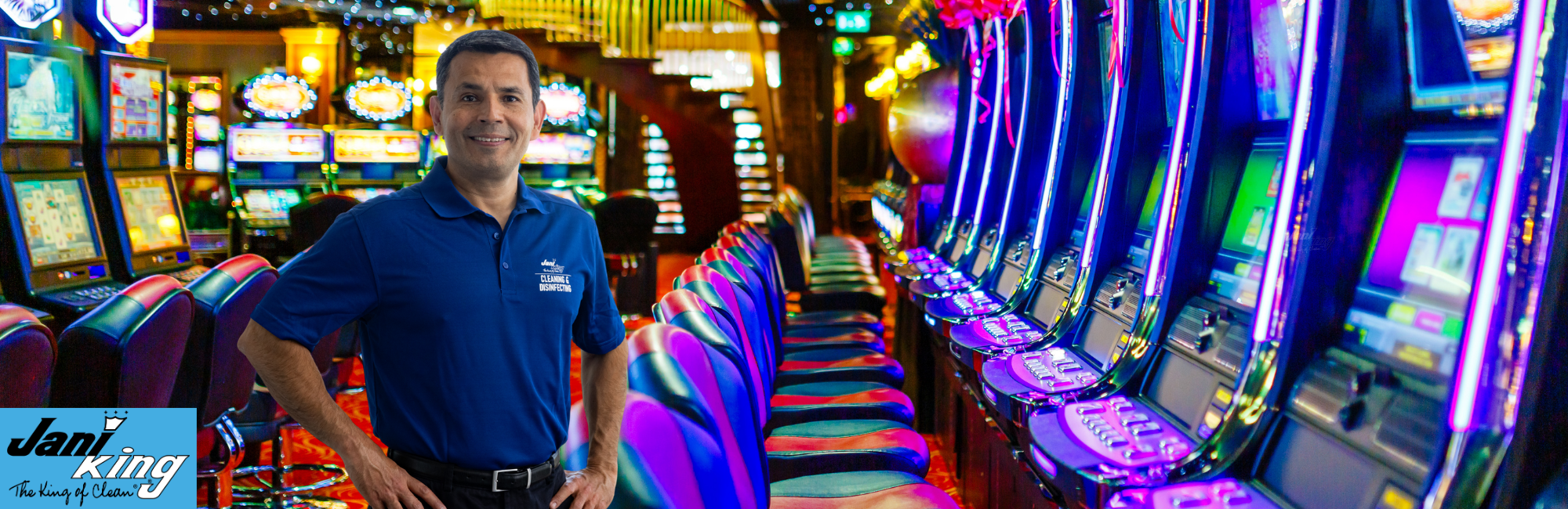 Jani-King employee standing on the clean casino floor.