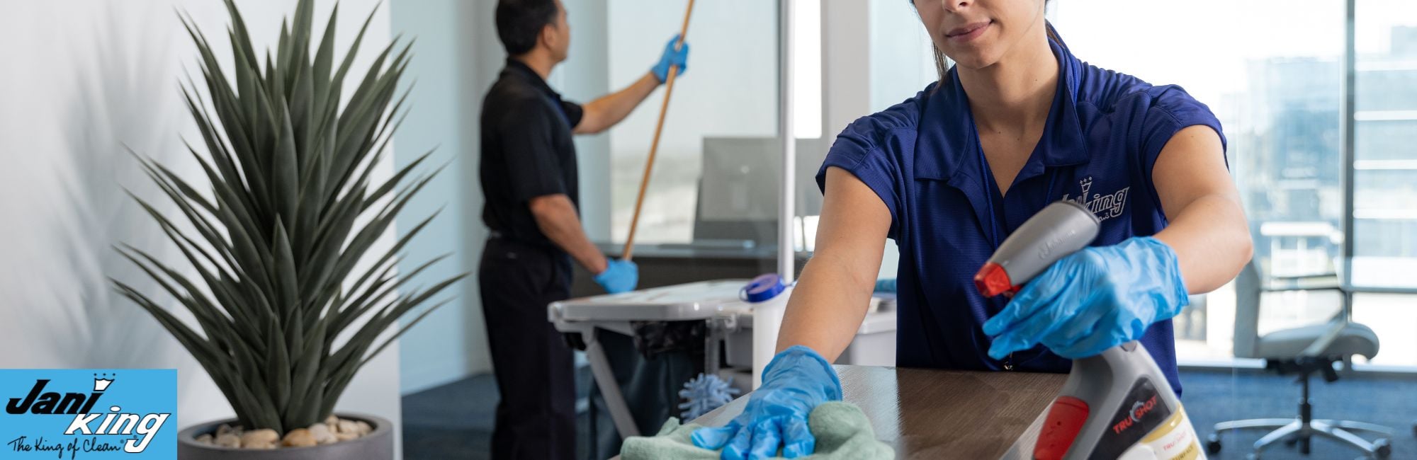 Jani-King Employees cleaning an office.