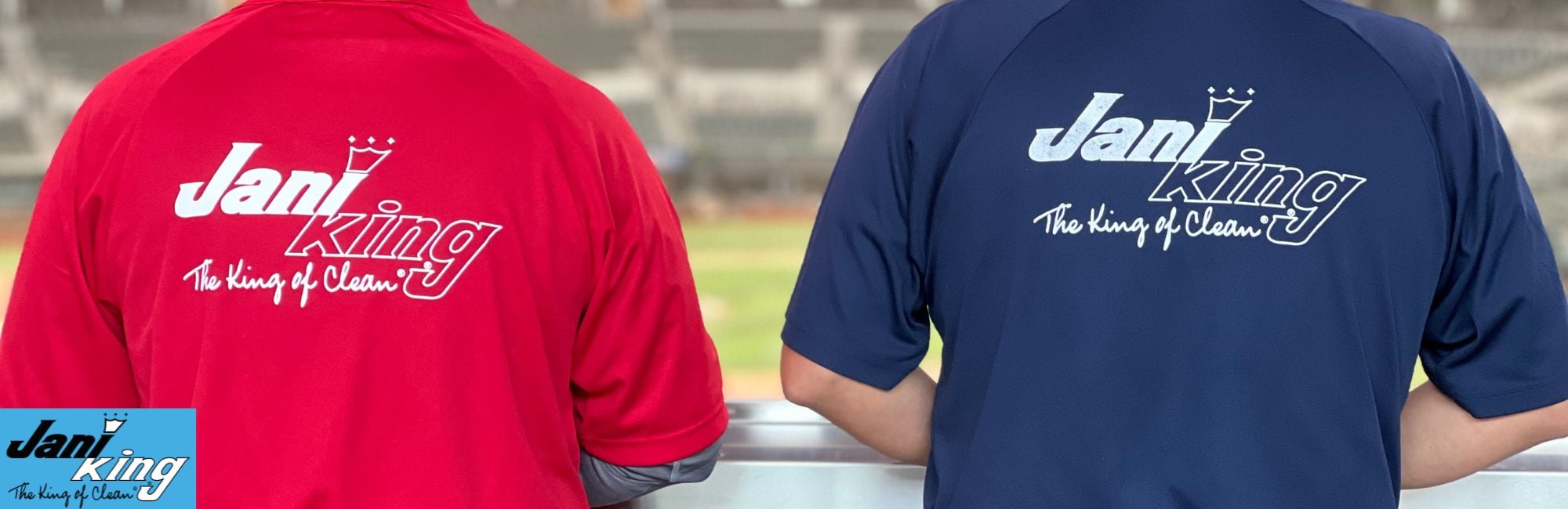 Two Jani-King employees looking into a baseball stadium.