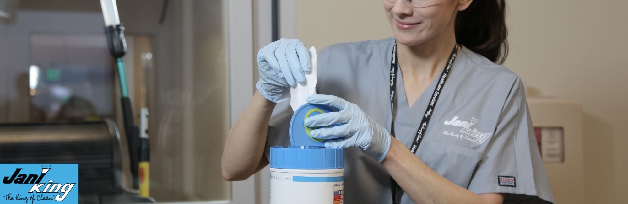 Jani-King employee cleaning a hospital suite.