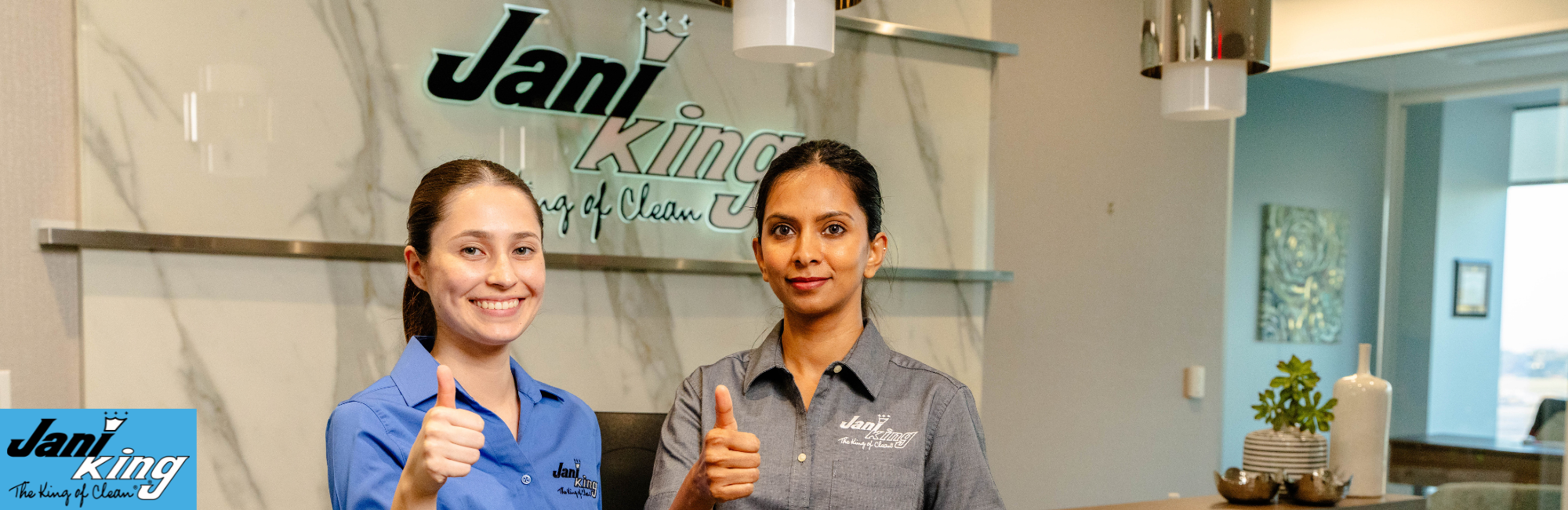 Two Jani-King employees proud to clean green