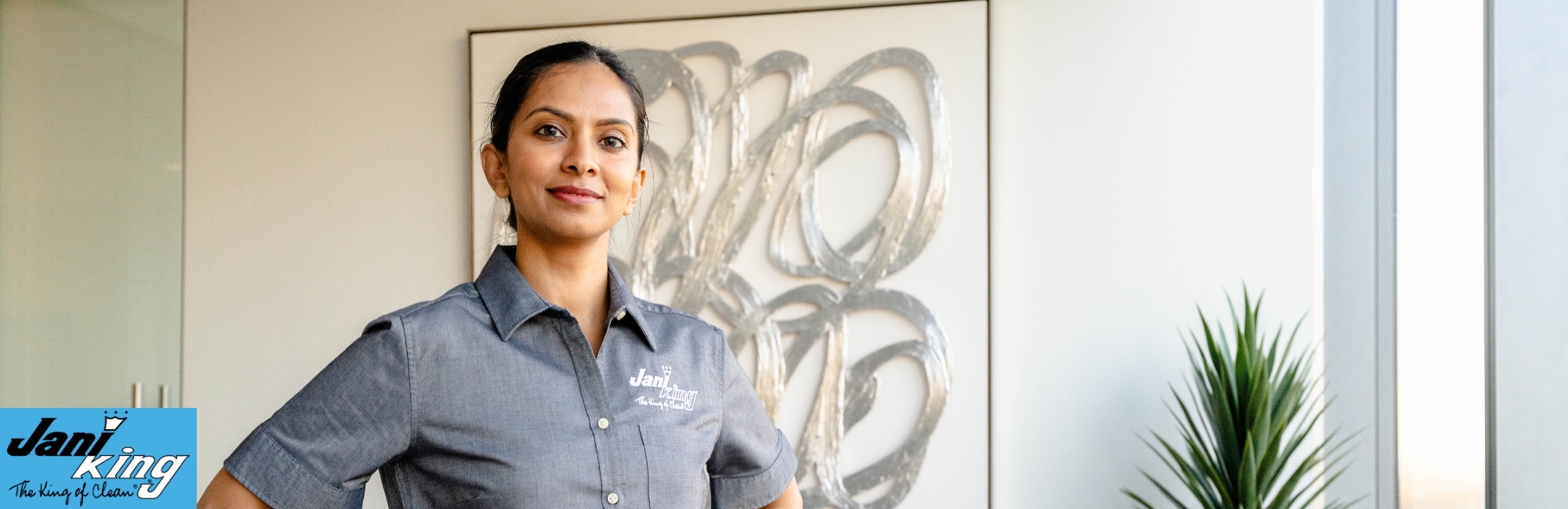 Jani-King employee proud of her work cleaning a hotel.