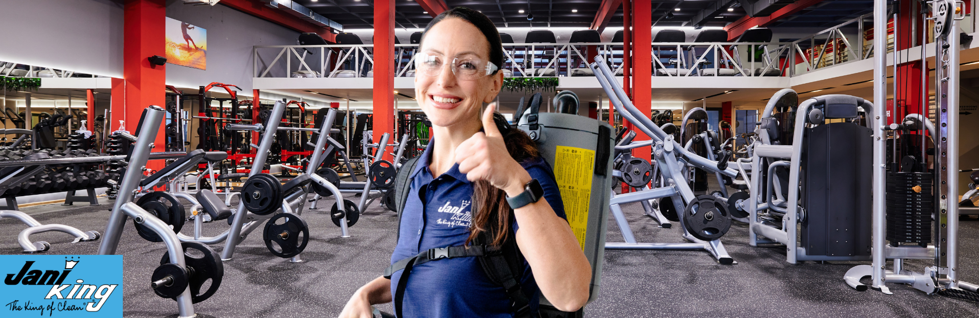 Jani-King employee cleaning a fitness center cleaning