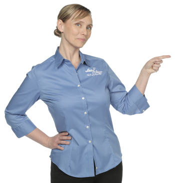 a woman in a blue shirt pointing at something